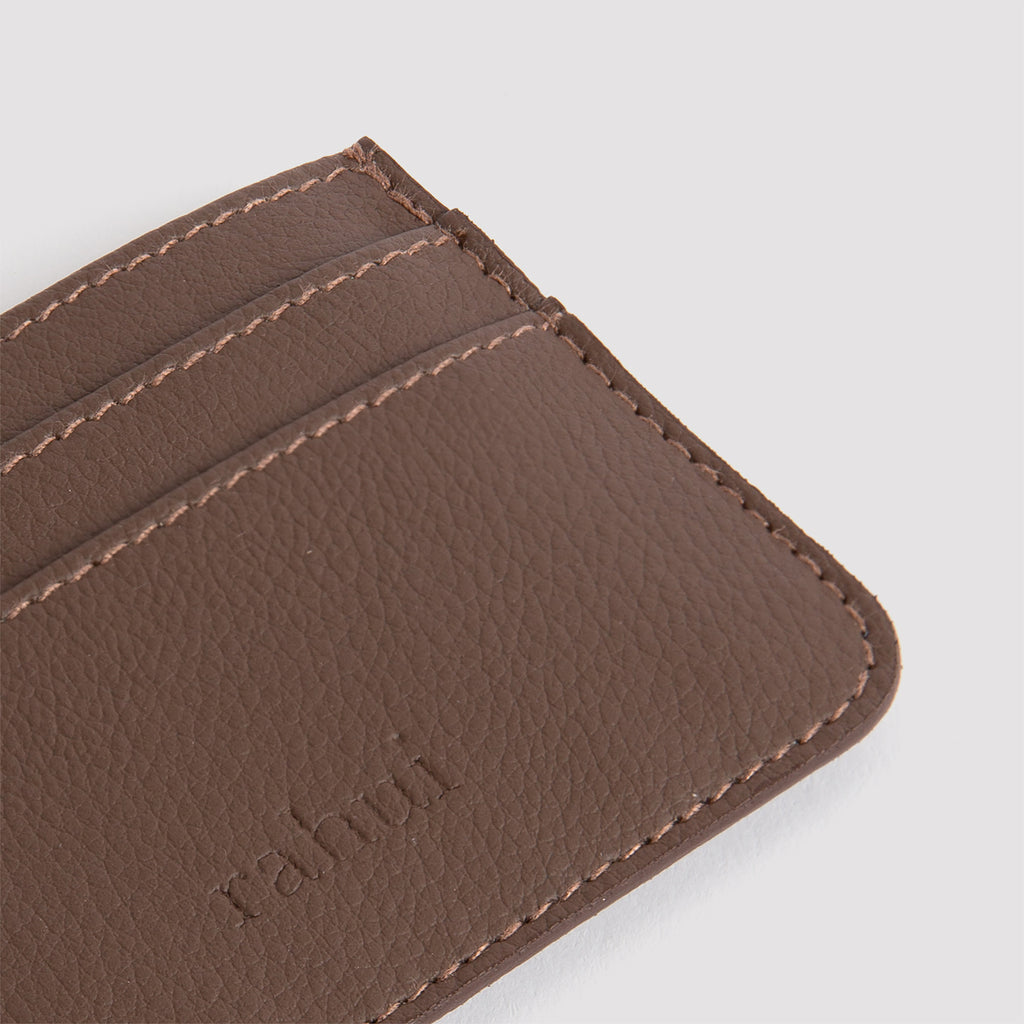 Close-up of Rahui Pinatex pineapple plant leather card wallet in brown