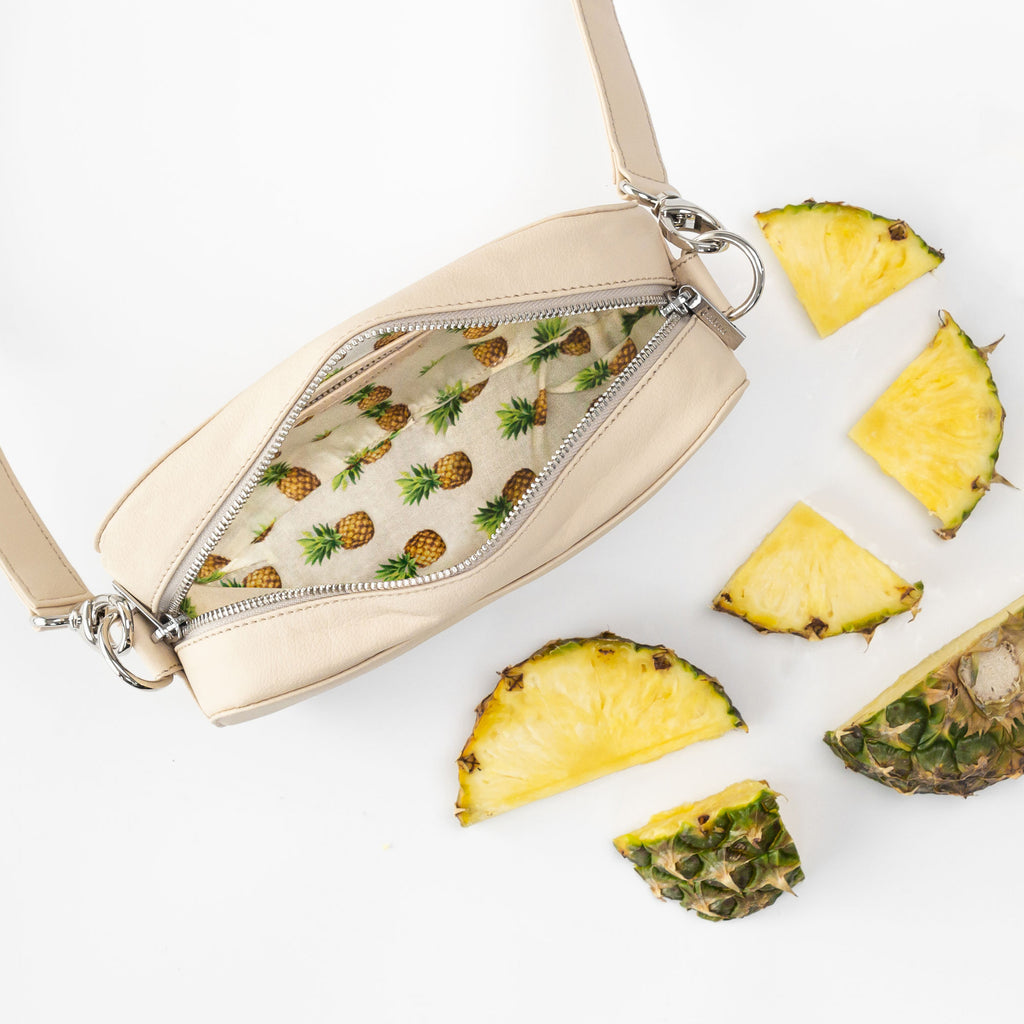 Rahui natural Pinatex Pine Cross Body Bag showing pineapple print lining