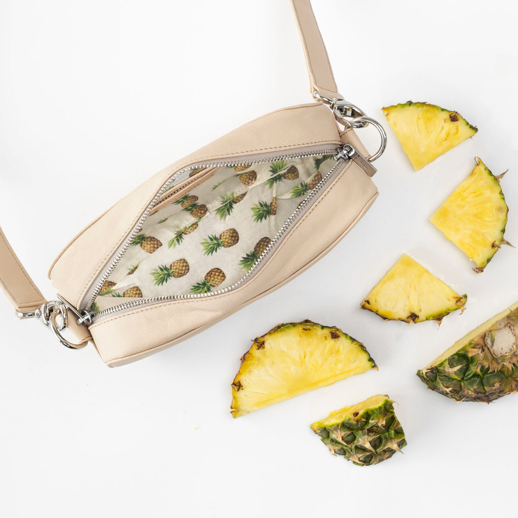 Rahui natural apple leather Pine Cross Body Bag showing pineapple print lining