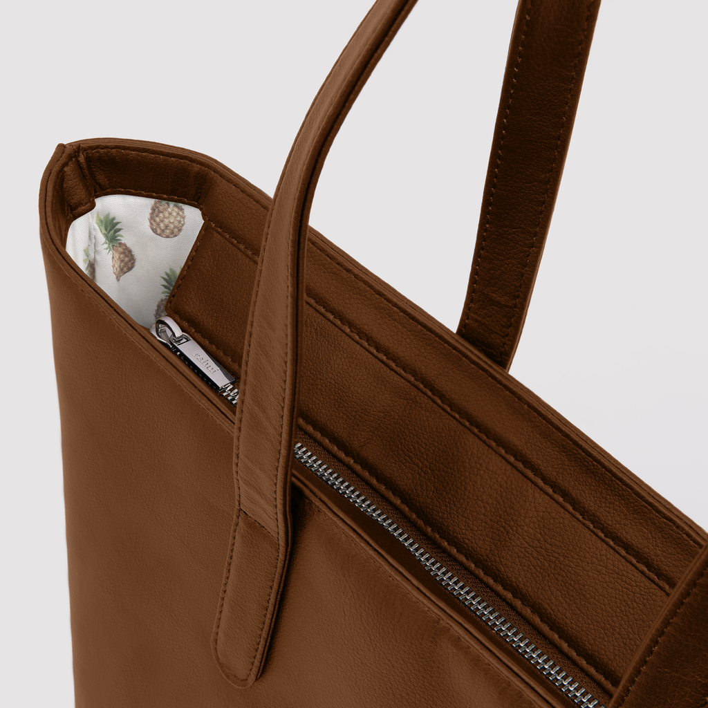 Rahui Tan Apple Leather Sequoia Zip Tote close up view of zip