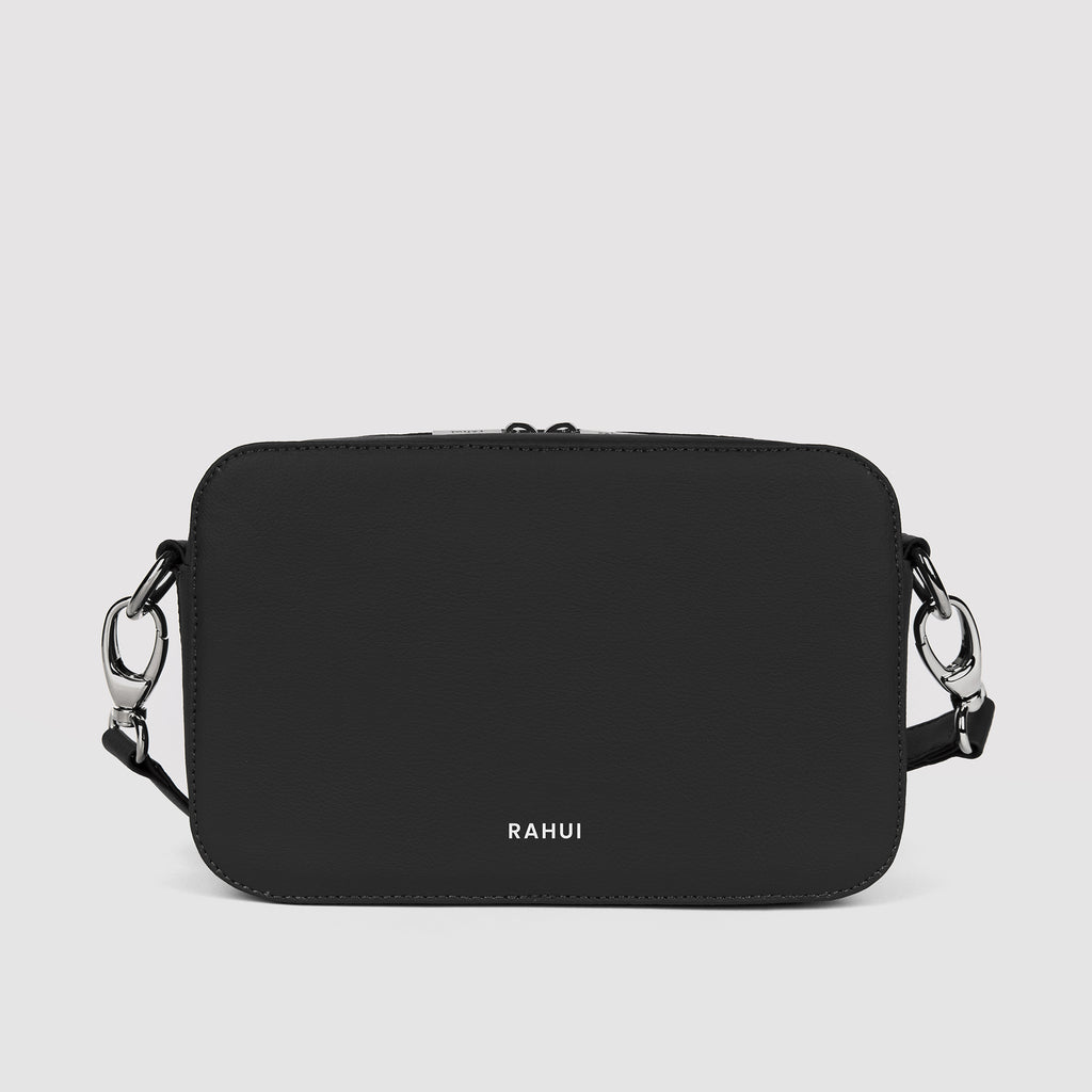 Front view of black Rahui Crossbody bag made from apple leather on white background