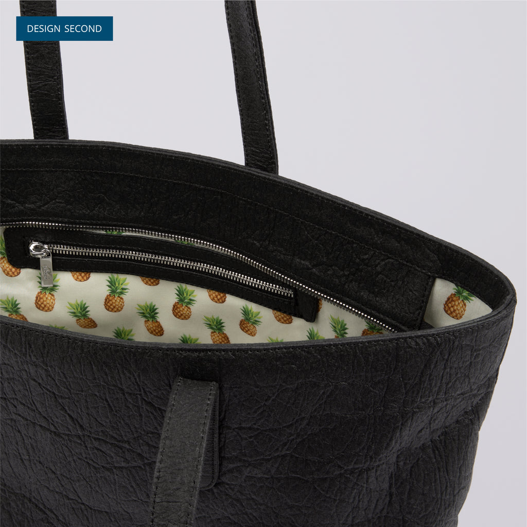 Inside view of textured black Rahui zip tote bag made from Pinatex Original on white background Design Second
