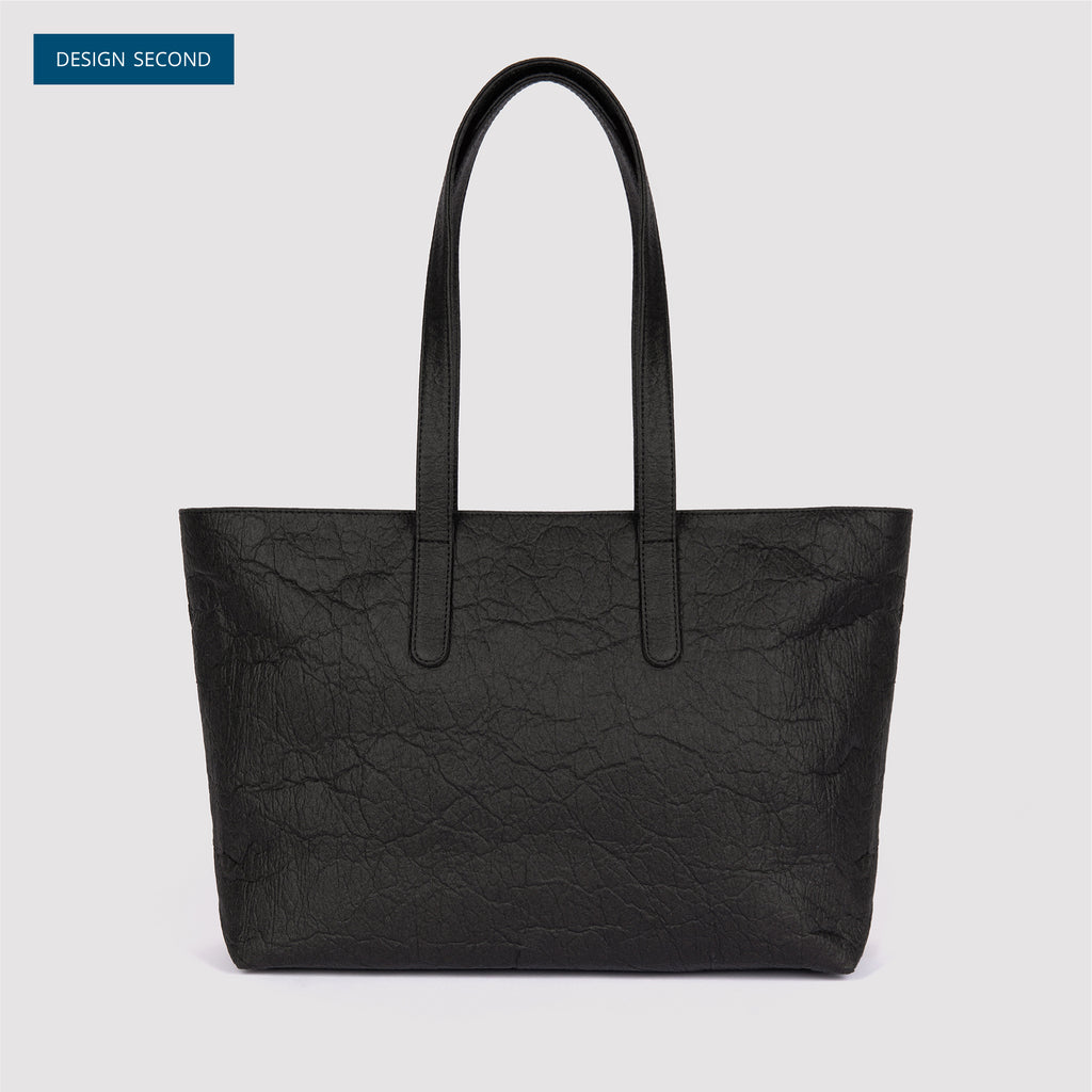 Front view of textured black Rahui zip tote bag made from Pinatex Original on white background Design Second